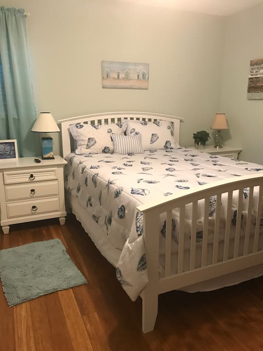 Guest Room has a comfortable Queen-Size bed, 2 night stands and ceiling fan.