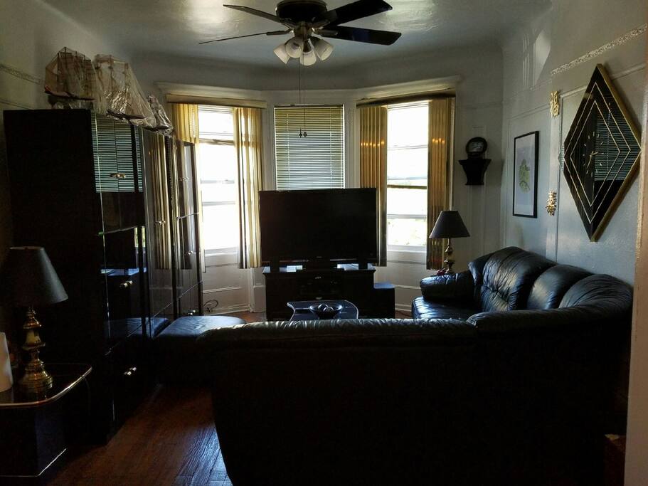 Living area with Leather Sectional and 50" Plasma TV (cable included) This room can accommodate up to two people with air mattresses