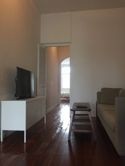 Living room with comfy couch and flatscreen TV!
