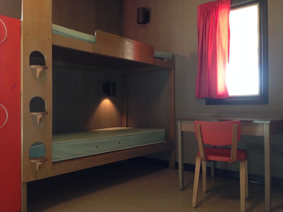 Our bunk bed units each have their own reading lamps. Colors will vary depending on cabin. There are outlets nearby and box fans in case the window AC unit doesn't provide enough white noise!