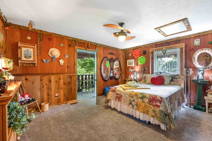 This bedroom features a nice queen mattress with 49 inch smart TV (cable included) and second story back balcony