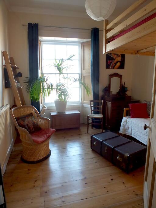 Skybed bedroom (Please note that the chair on the left has been removed. We will be updating the photo soon)