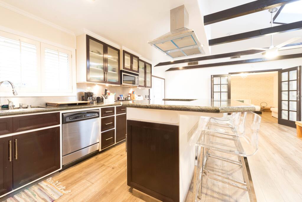 Full kitchen with cooking utensils' and supplies for guests' use
