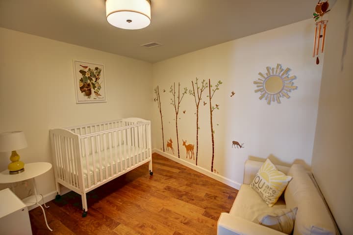 Oriole Room - Nursery with Crib + Single Sofabed for a child.