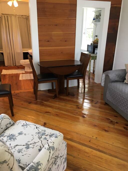 living and dining area: sofa, rocker, dinette table, flat screen tv with cable and WiFi