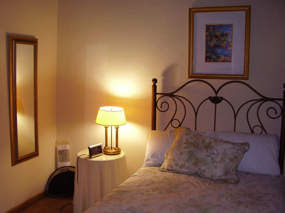 Well appointed bedrooms with old world wooden floors: