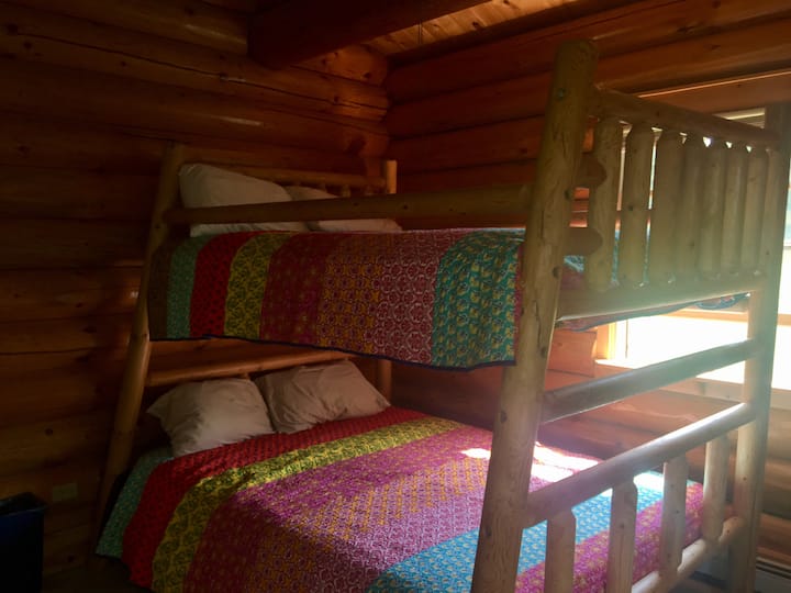 Bedroom with queen on bottom bunk, full on top