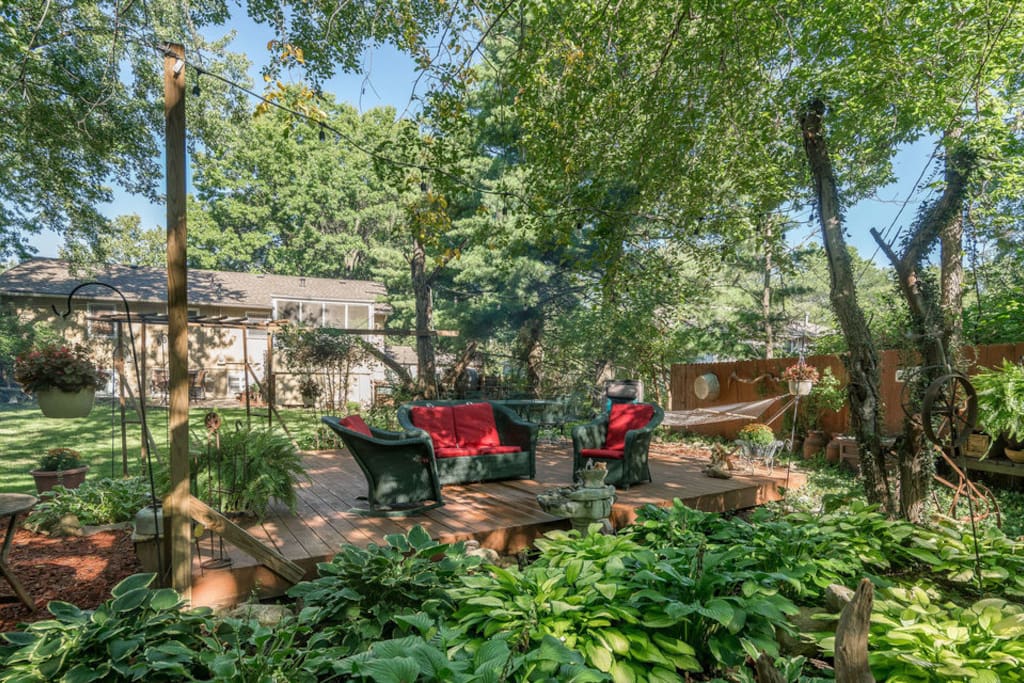 Back yard retreat with a fountain and hosta gardens.