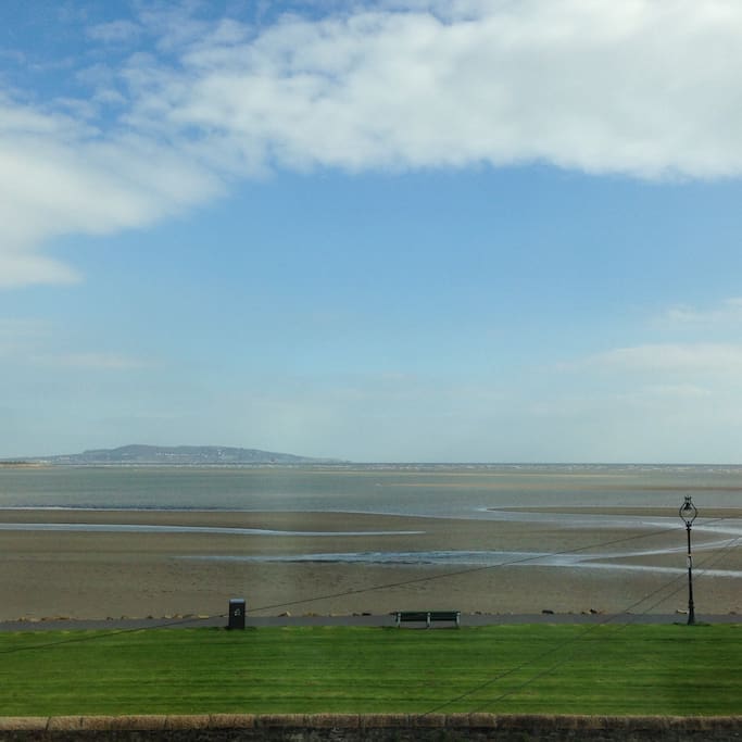 View from the bedroom window over Dublin Bay. Here the tide is half -way.
