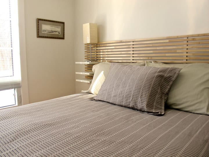 The North bedroom has a queen bed, also with a front yard view.