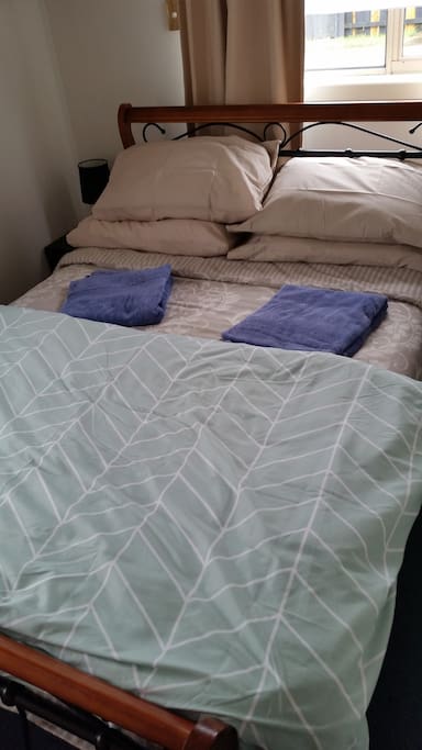 Clean linen & towels provided with a comfy bed.