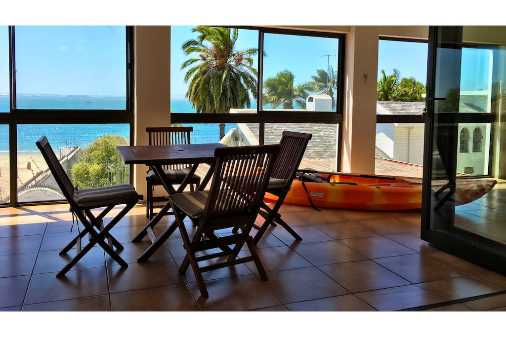 Enclosed balcony with indoor barbecue facilities.
