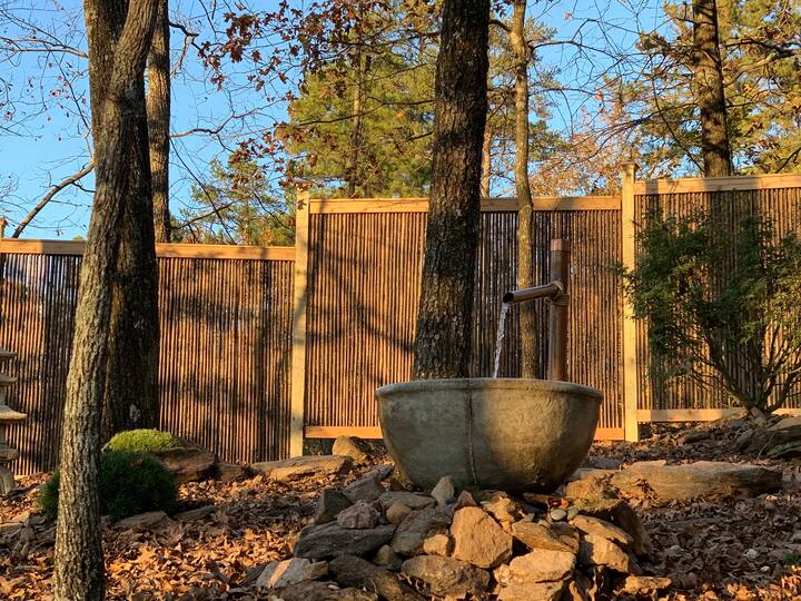 The custom black bamboo fence is the perfect accent and backdrop for Trinity Treehouse’s Zen Garden