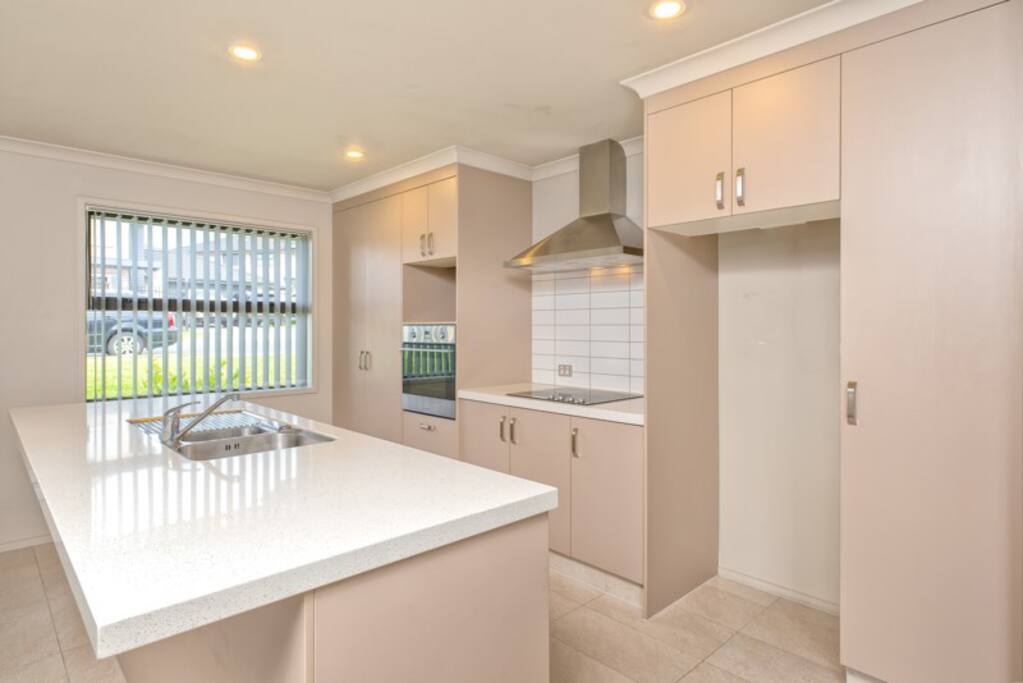 Open plan kitchen space leads to dinning area as well as the lounge