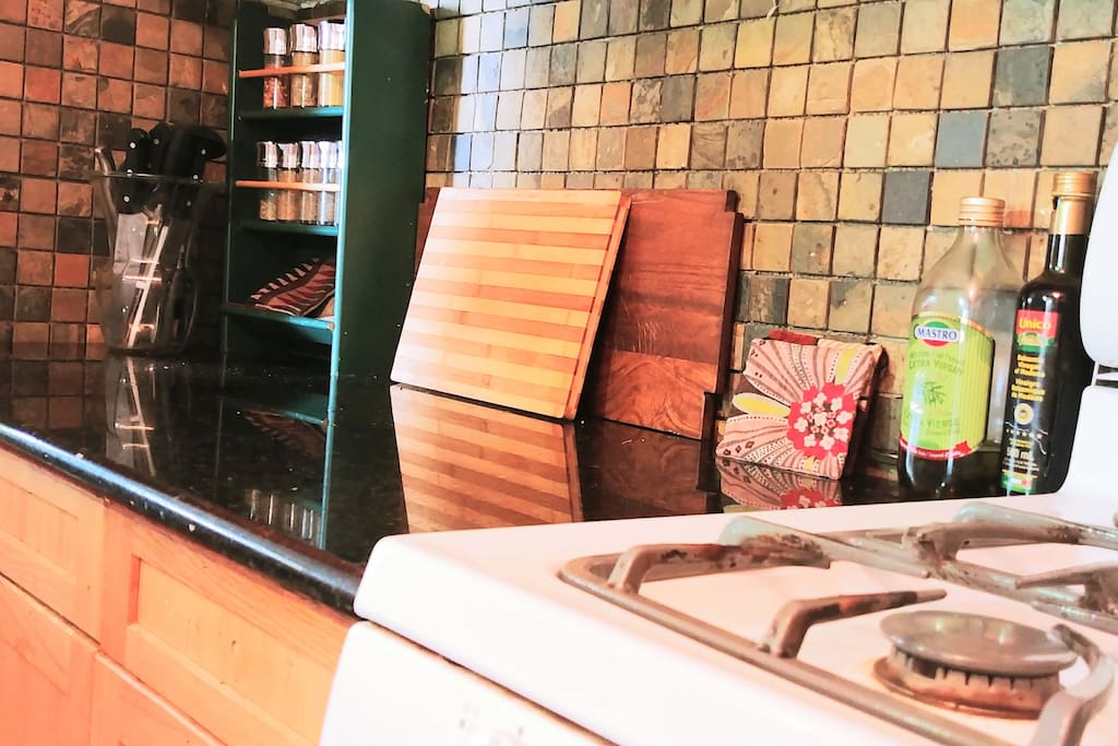 Granite counter, tiles, and gas stove