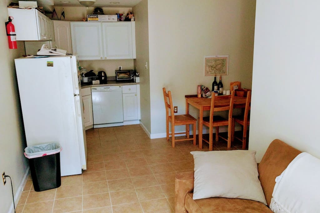 Living room and kitchen, and partial view of dining area