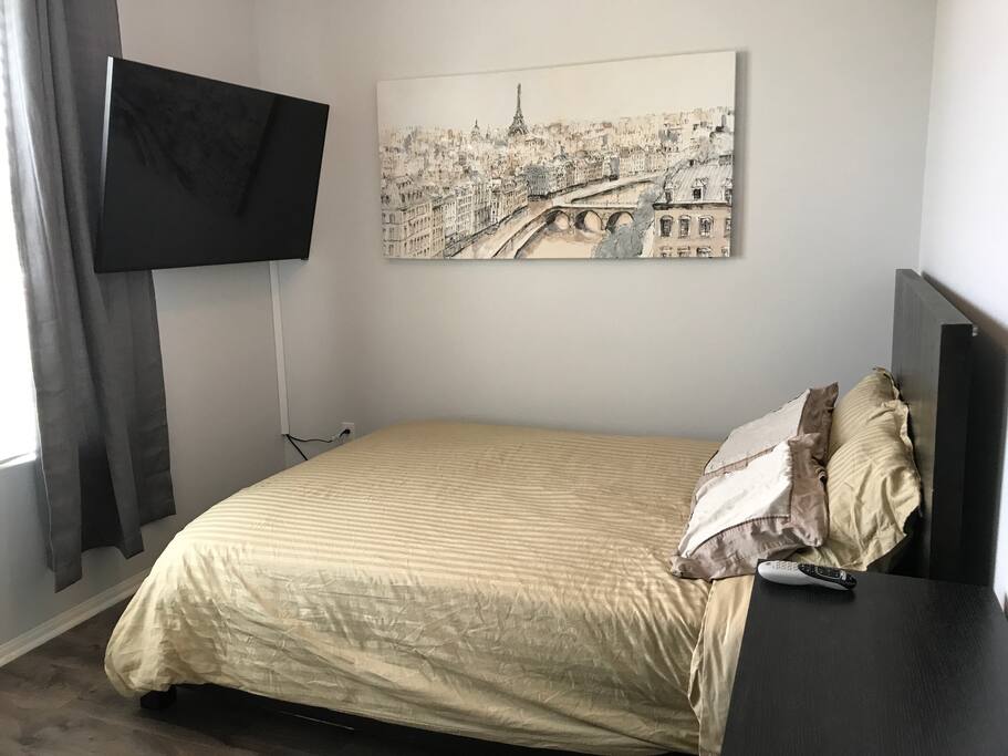 Queen Bed with TV