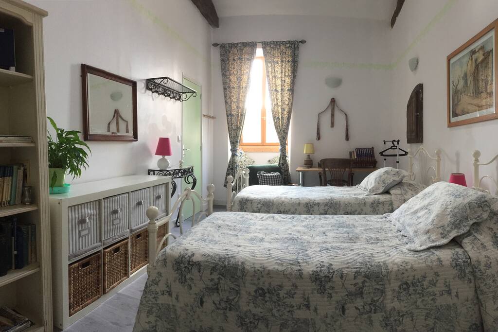 Guest Room 2 with two single beds, with en-suite shower room and toilet