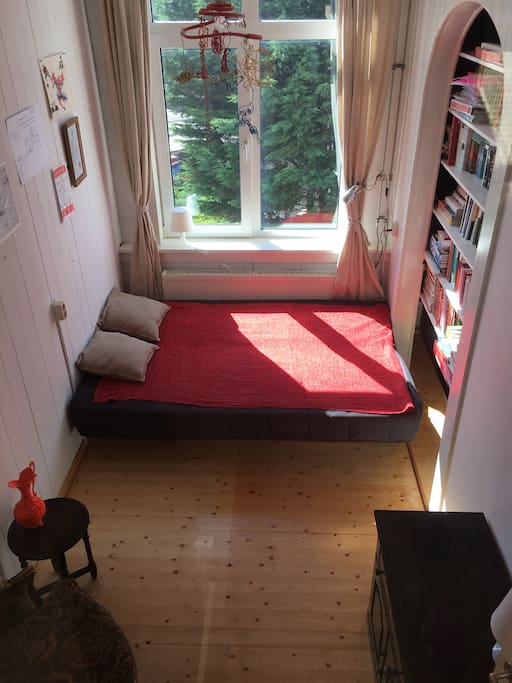 The fold-out couch turns into a comfortable double bed easily. Bed sheets included of course :)