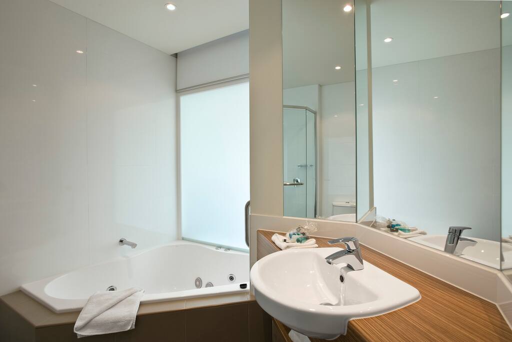 Bathroom with spa and seperate shower area
