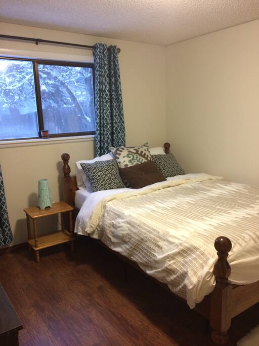 Brightly lit private bedroom for two