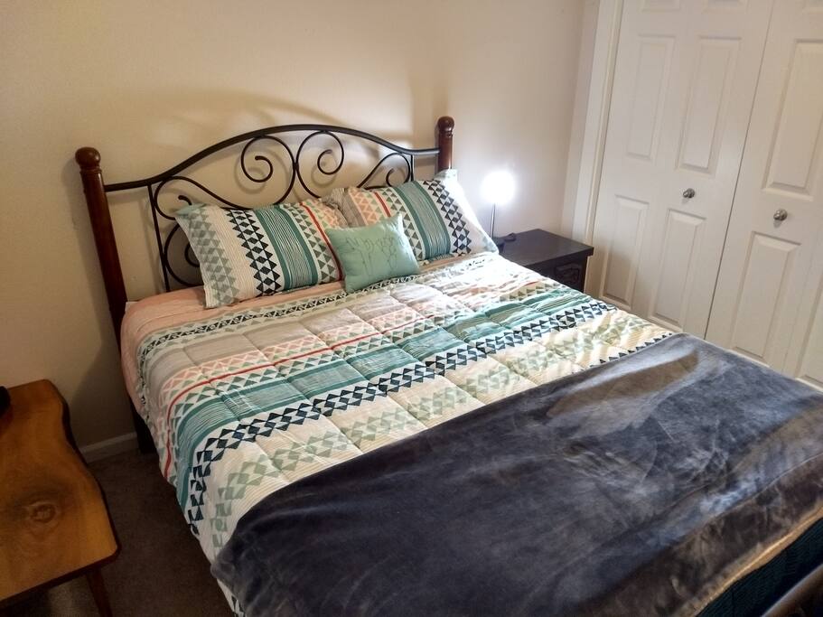 Queen bed. Closet with extra pillows and blanket.