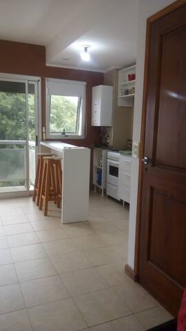 Single-room with covered garage and balcony.