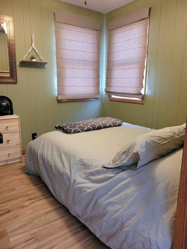 Room #2 - Full size bed, includes a dresser and nightstand with a lamp and sound machine.