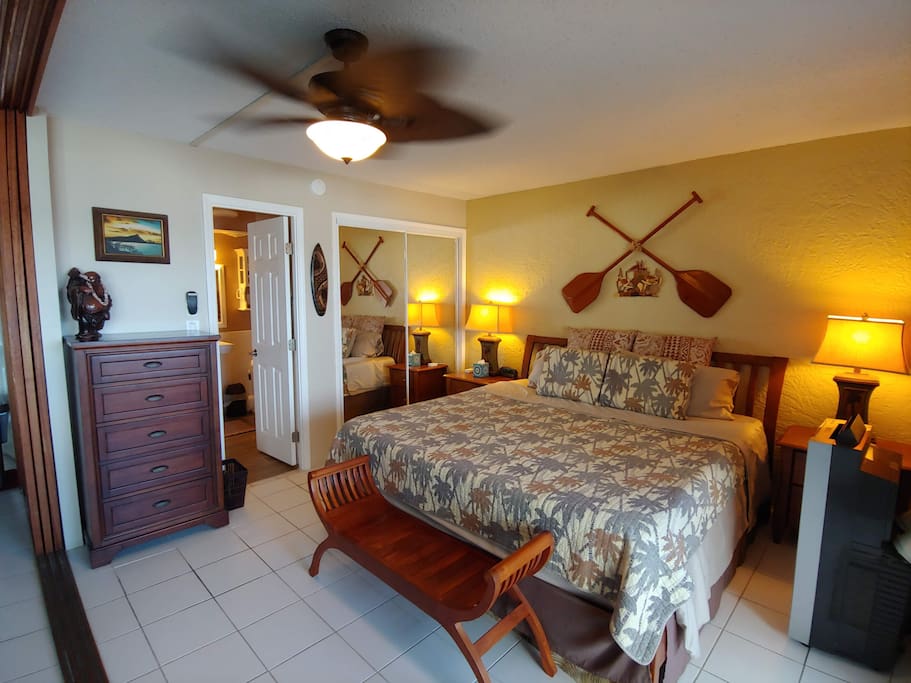 Master bedroom with Tommy Bahama decor and ensuite bathroom