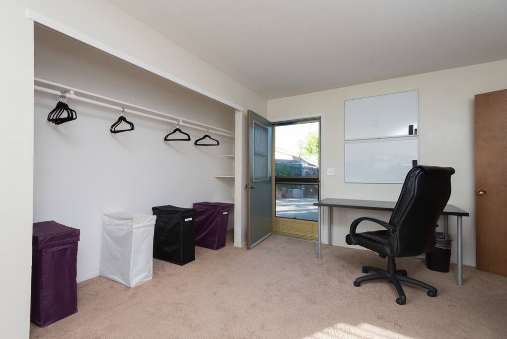 Desks and whiteboards in each room