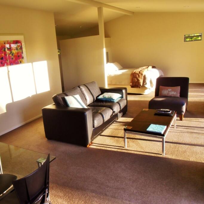 The cottages feature spacious open-plan living and dining that takes in the panoramic views of the vineyard and mountains.