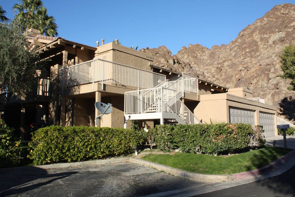 Front of condo nestled among the mountains
