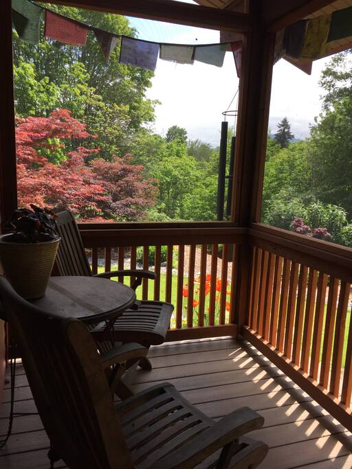 The covered porch offers comfortable seating.