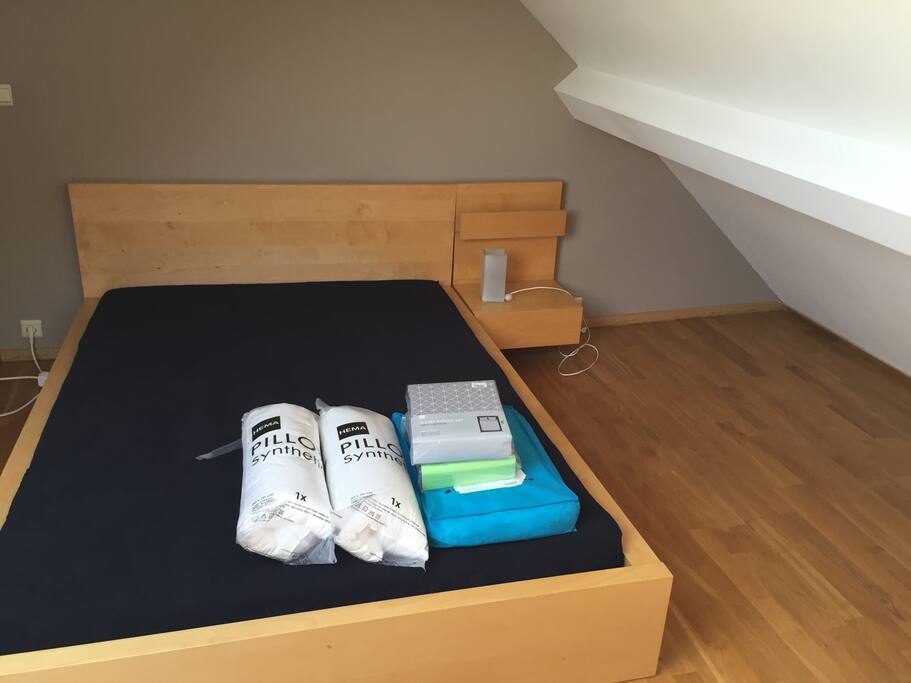 Large double bed with sheets