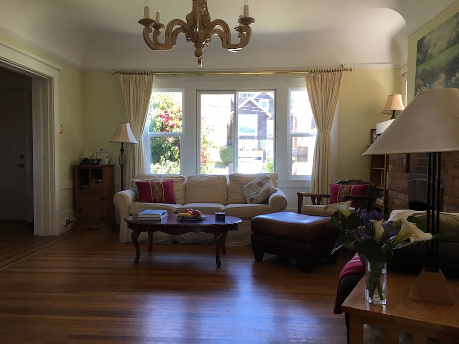 spacious living room with 3 seater sofa, rocking chair and recliner