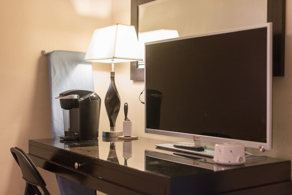 In your bedroom. Beautiful large, high quality computer desk with a 46 inch flat screen tv with chromecast. Cast your favorite Hulu and Netflix!