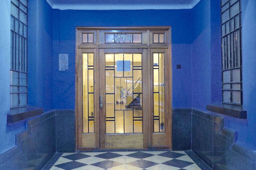 Apartment building entrance at dawn.