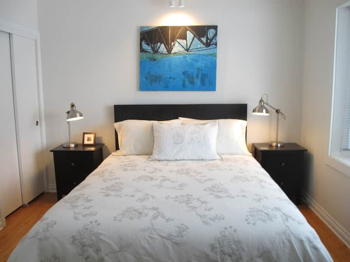 The Master bedroom has a queen bed, with a large bay window overlooking the rear garden.