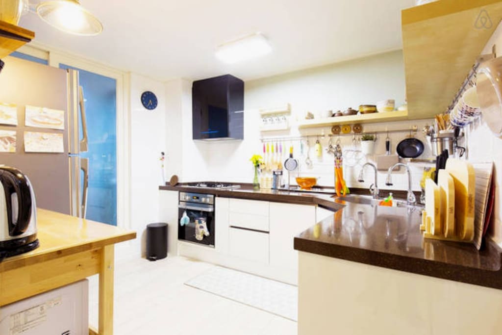 Various cooking utensils and a big kitchen