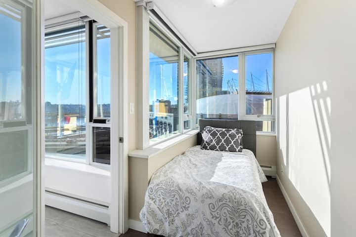 Twin bed in Den. Room enough for a twin bed and some luggage storage. 

Den has windows that open along with blackout blinds.