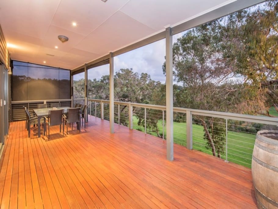 Expansive balcony with BBQ and dining table