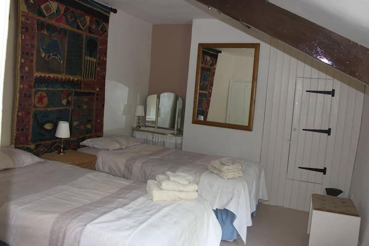 Second twin bedded room with original oak beam and overlooking the rear garden