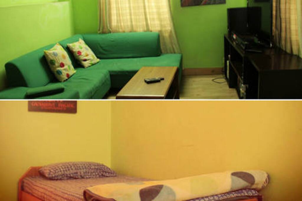 Bed on one side and the couch on the other side