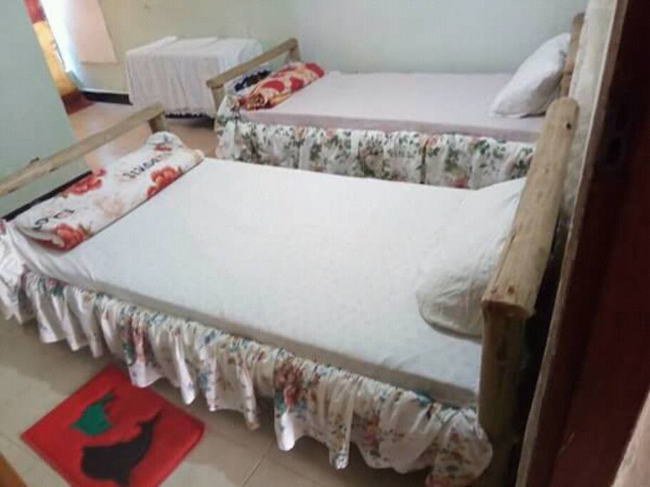 double bed set in a room for two clients, with its owm washroom