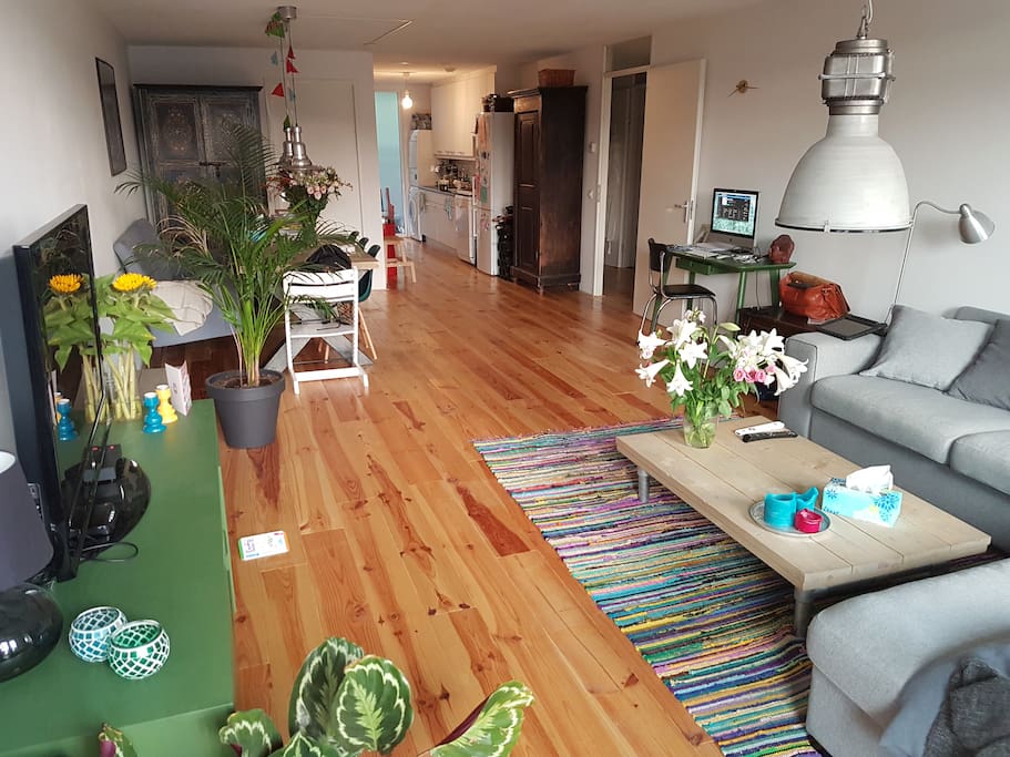 Livingroom from balcony door with kitchen in the back