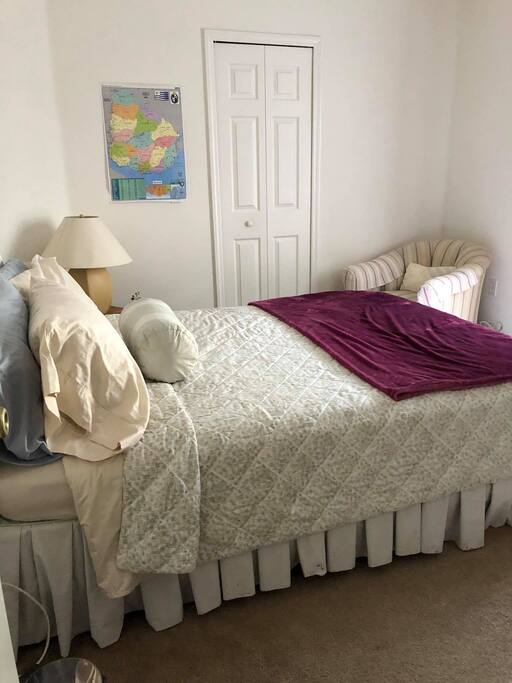 Cozy room with ample closet and drawer storage.