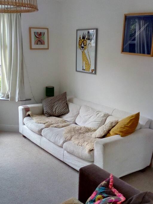 Adjoining sitting room with two sofas and television