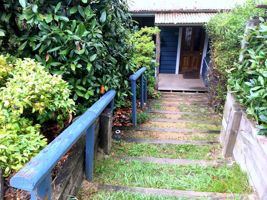 Front door is 13 steps down from the parking area