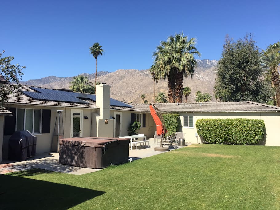 Back Yard showing above ground hot tub and lounge area