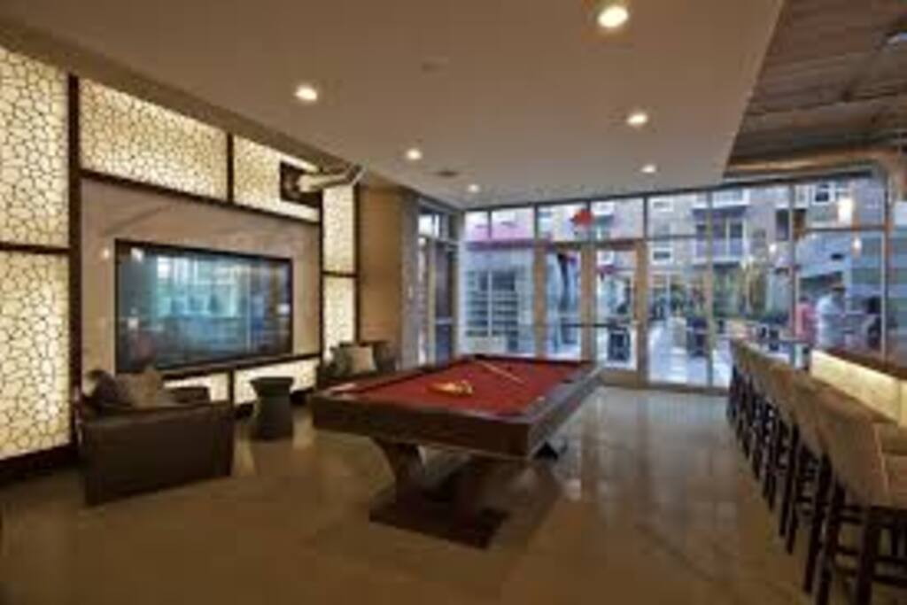 Bar lounge with billiards and shuffleboard.